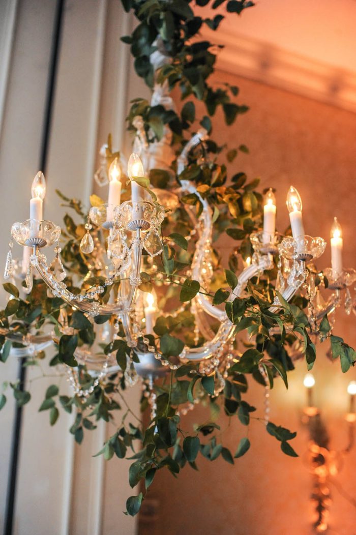 chandelier covered in greenery