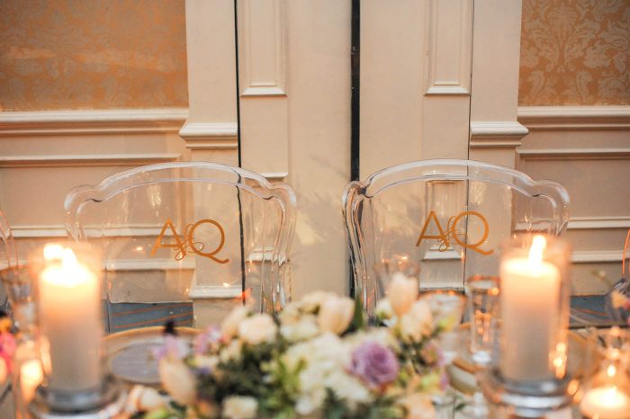 monogram ghost chairs at wedding